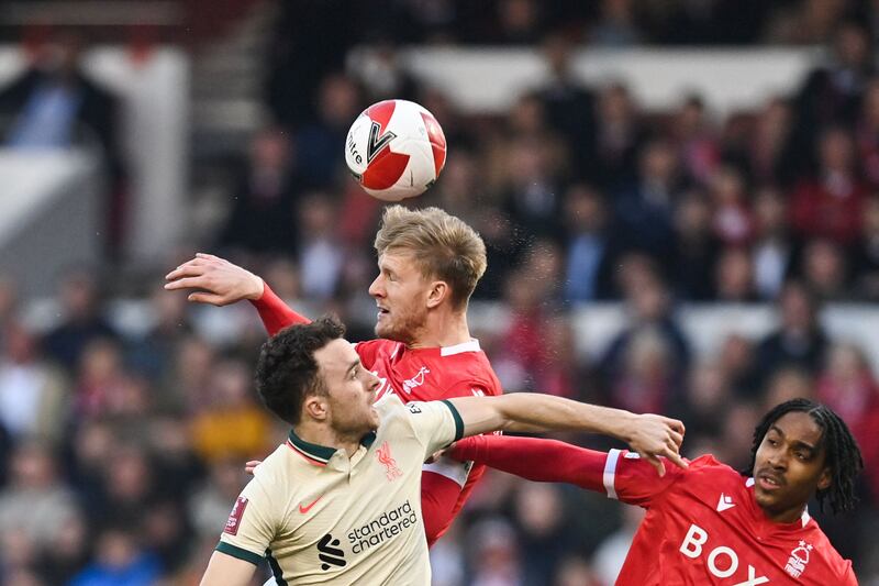 Diogo Jota battles with Forest's Joe Worrall and Djed Spence. AFP