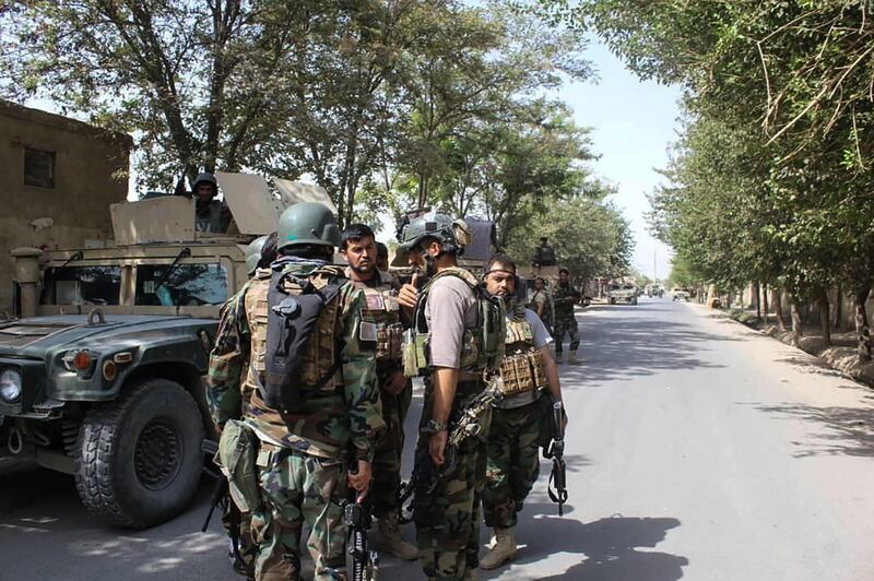 Afghan security forces gather at a street in Kunduz on August 31, 2019. Afghan security forces "repelled" a coordinated Taliban assault on the northern city of Kunduz on August 31, President Ashraf Ghani said, amid competing claims from the insurgents. The multi-pronged offensive on Kunduz, which has come under frequent attack since 2015, occurred as US and Taliban negotiators continue to seek an agreement in Doha that would see thousands of American troops leave Afghanistan in return for various security guarantees.
 / AFP / Bashir KHAN SAFI
