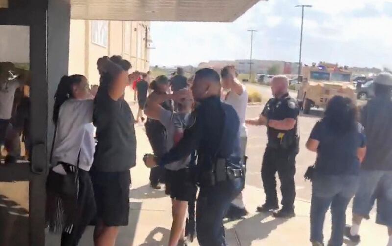 People are evacuated from Cinergy Odessa cinema following a shooting in Odessa, Texas, U.S. in this still image taken from a social media video.  REUTERS