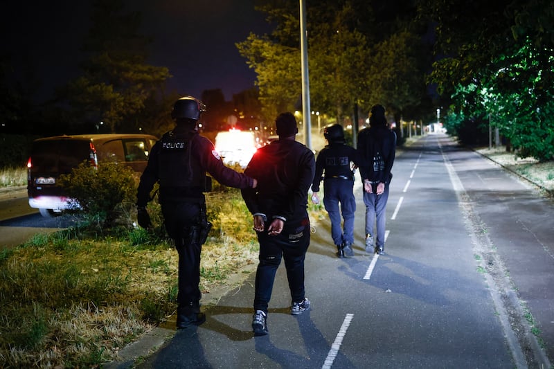 Teenagers are arrested in the Parisian suburb of Nanterre. EPA