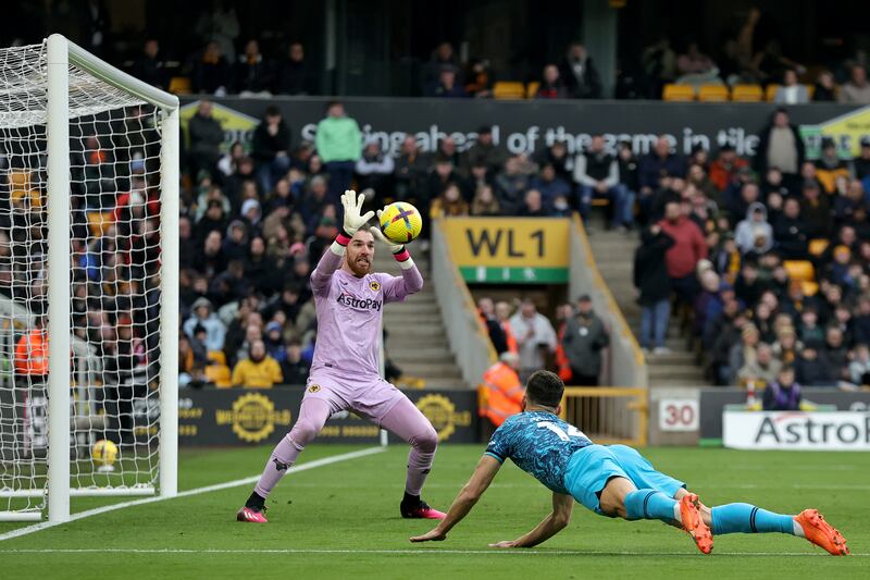 Wolves goalkeeper Jose Sa saves a header from Ivan Perisic of Spurs. Getty