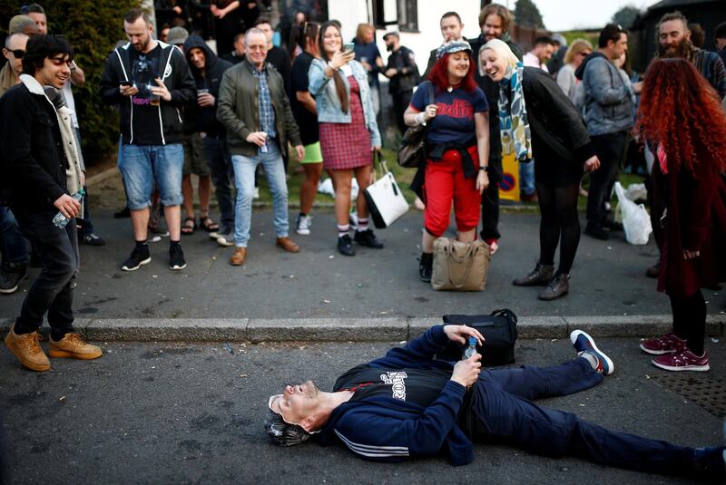 A fan takes a break while celebrating. REUTERS