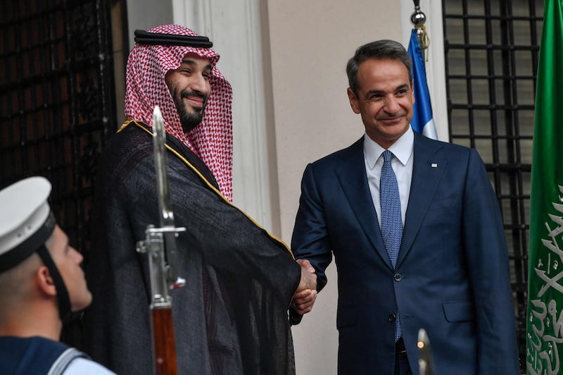 Greek prime minister Kyriakos Mitsotakis greets Saudi Crown Prince Mohammed bin Salman prior to their meeting at the prime minister's office in Athens on July 26, 2022. AFP