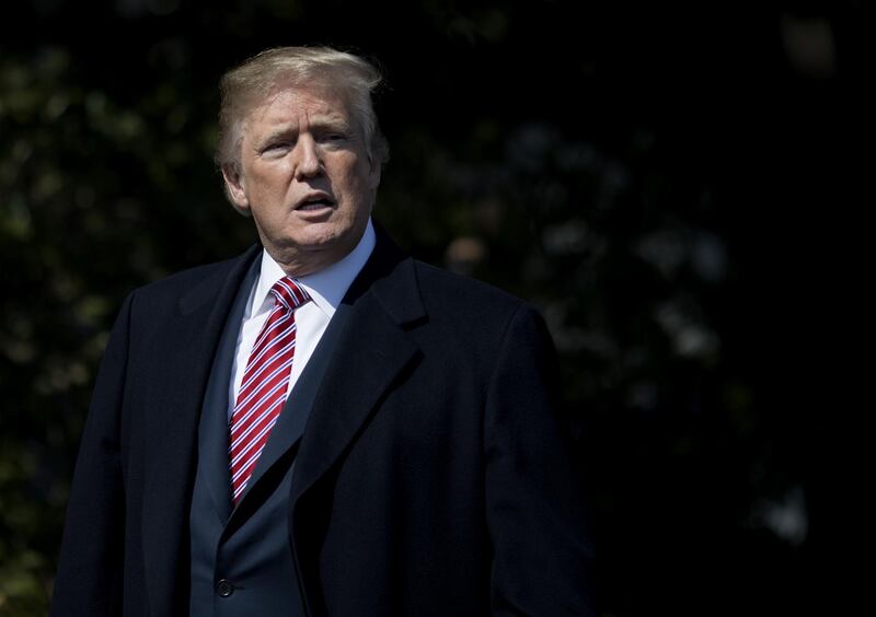 U.S. President Donald Trump speaks to members of the media while walking towards a ceremony honoring the 2017 NCAA Football National Champion Alabama Crimson Tide on the South Lawn of the White House in Washington, D.C., on Tuesday, April 10, 2018. An FBI raid on Trump's longtime lawyer has transformed the president's purported affairs with an ex-Playboy model and an adult film star from political obstacles he could swat away into potentially serious legal problems that could imperil his presidency. Photographer: Eric Thayer/Bloomberg