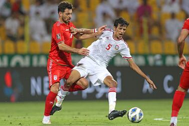 Players vie for the ball during the 2022 Qatar World Cup Asian Qualifiers football match between the United Arab Emirates and Iran, at the Zabeel Stadium in Dubai, on October 7, 2021.  (Photo by -  /  AFP)