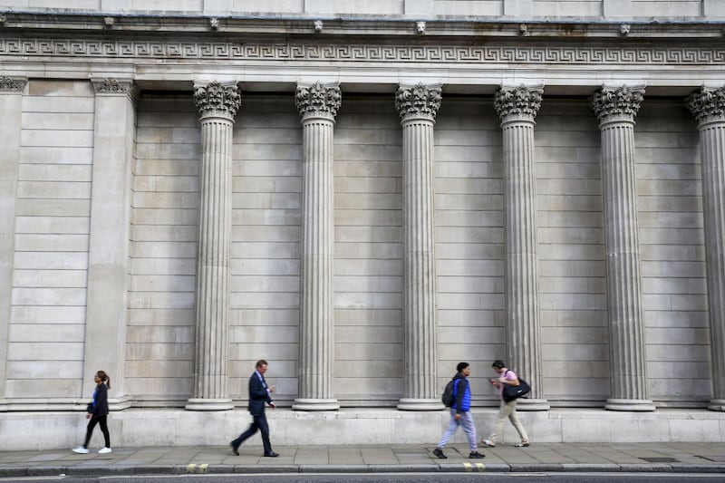 Pedestrians pass the Bank of England in the City of London financial district in London, U.K., on Monday, Aug. 19, 2019. The European Central Bank blasted banks for slow-walking their Brexit preparations, telling them to move additional staff and resources to the European Union in case Britain leaves without a deal on Oct. 31. Photographer: Hollie Adams/Bloomberg