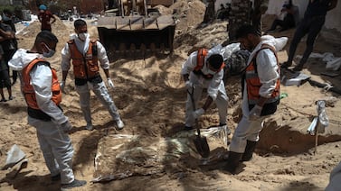 Health workers unearth bodies found at Nasser Hospital in Khan Yunis in the southern Gaza Strip on April 23, 2024 amid the ongoing conflict between Israel and the Palestinian militant group Hamas.  (Photo by AFP)