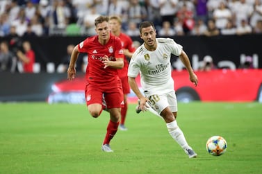 Jul 20, 2019; Houston, TX, USA; Real Madrid forward Eden Hazard (50) controls the ball as Bayern Munich defender Joshua Kimmich (32) chases during the first half of the International Champions Cup soccer series at NRG Stadium. Mandatory Credit: Kevin Jairaj-USA TODAY Sports