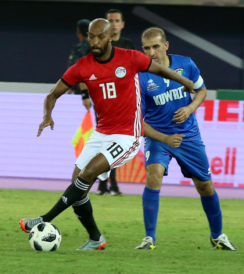 Egyptian midfielder Shikabala (L) drives the ball during the international friendly football match between Kuwait and Egypt at the Jaber Al Ahmad International Stadium in Kuwait City on May 25, 2018. / AFP PHOTO / Yasser Al-Zayyat