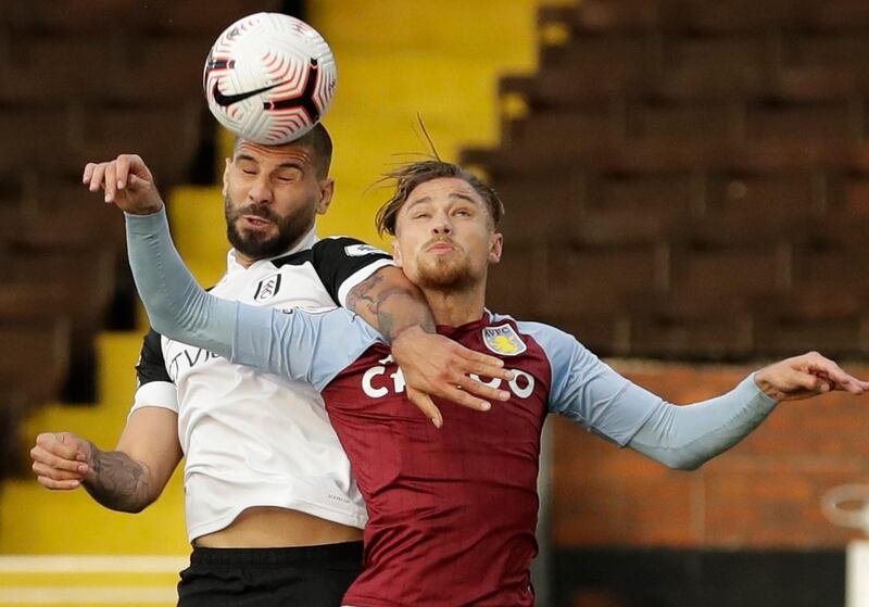 Fulham's Aleksandar Mitrovic in action with Aston Villa's Matty Cash. Reuters