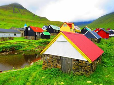 Colourful homes on the Faroe Islands, one of the most easily accessible island destinations on the UK's Green List of countries where people can travel to without quarantine upon return. Unsplash