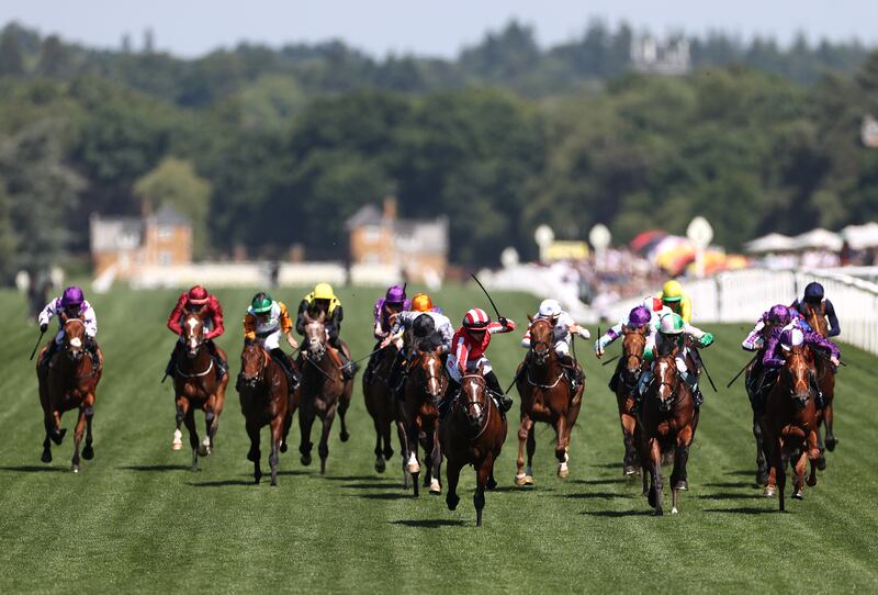 Bradsell, ridden by Hollie Doyle, centre red, charges towards the finish line at Royal Ascot, England. Getty Images