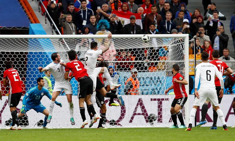 Match 2: Uruguay's Jose Gimenez scores against Egypt. Reuters