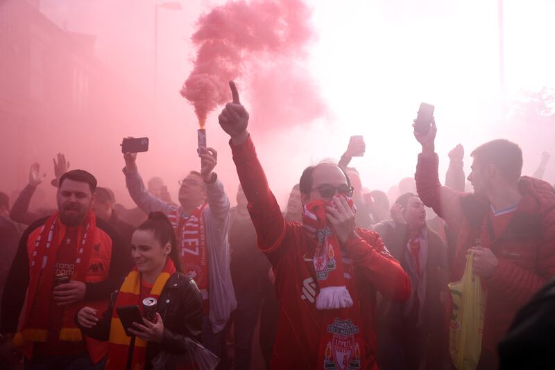  Liverpool fans with flares outside the stadium. Reuters