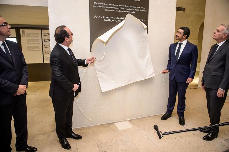 French president Francois Hollande and Sheikh Abdullah bin Zayed unveil a commemorative plaque. Christophe Petit Tesson / AFP