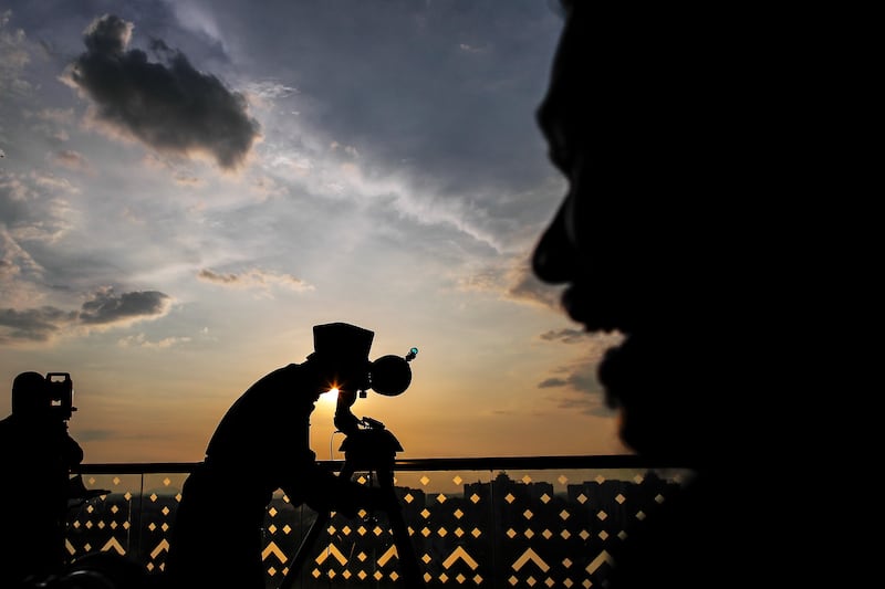 Islamic religious officers in Putrajaya, Malaysia, observe the position of the moon to determine the sighting of the Ramadan crescent that marks the start of the month. EPA