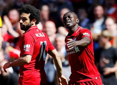 Soccer Football - Premier League - Liverpool v Wolverhampton Wanderers - Anfield, Liverpool, Britain - May 12, 2019  Liverpool's Sadio Mane celebrates scoring their first goal with Mohamed Salah  REUTERS/Phil Noble  EDITORIAL USE ONLY. No use with unauthorized audio, video, data, fixture lists, club/league logos or "live" services. Online in-match use limited to 75 images, no video emulation. No use in betting, games or single club/league/player publications.  Please contact your account representative for further details.