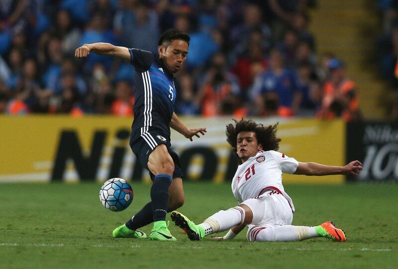 UAE's Omar Abdulrahman, right, tackles Yuto Nagatomo of Japan during the 2018 World Cup qualifying match at Hazza bin Zayed Stadium on March 23, 2017 in Al Ain City, UAE. Francois Nel / Getty Images