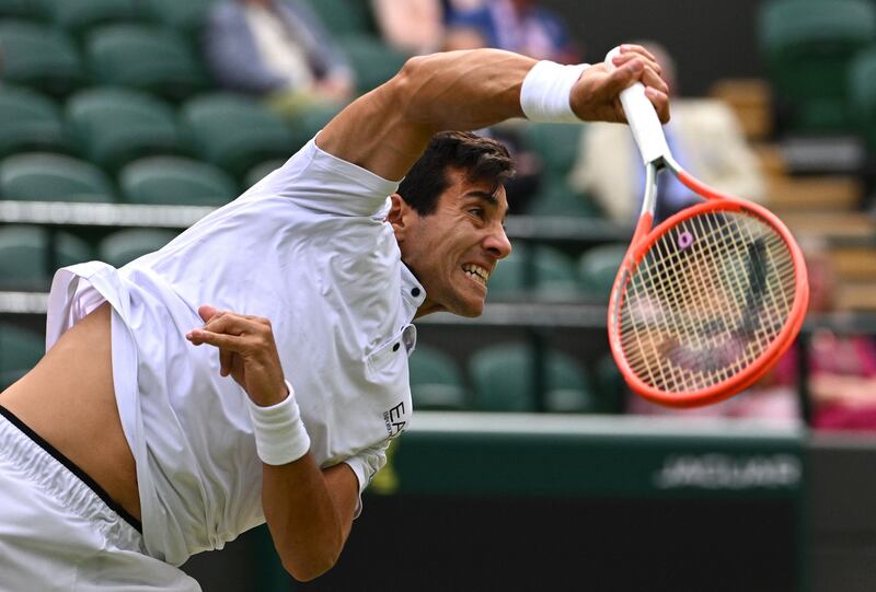 Chile's Cristian Garin serves against Australia's Nick Kyrgios. AFP