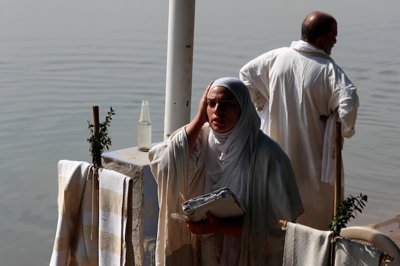 An Iraqi Mandaean woman performing a religious ritual during the Benja festival in Baghdad. Reuters