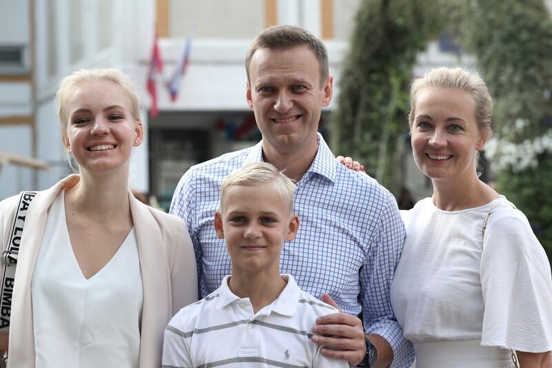 Mr Navalny with his wife Yulia, daughter Daria and son Zakhar, in Moscow in 2019. AP