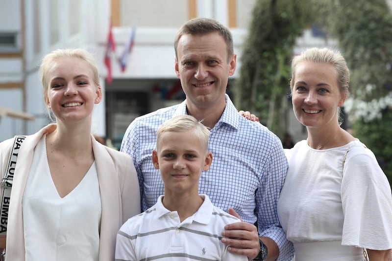 Mr Navalny with his wife Yulia, daughter Daria and son Zakhar, in Moscow in 2019. AP