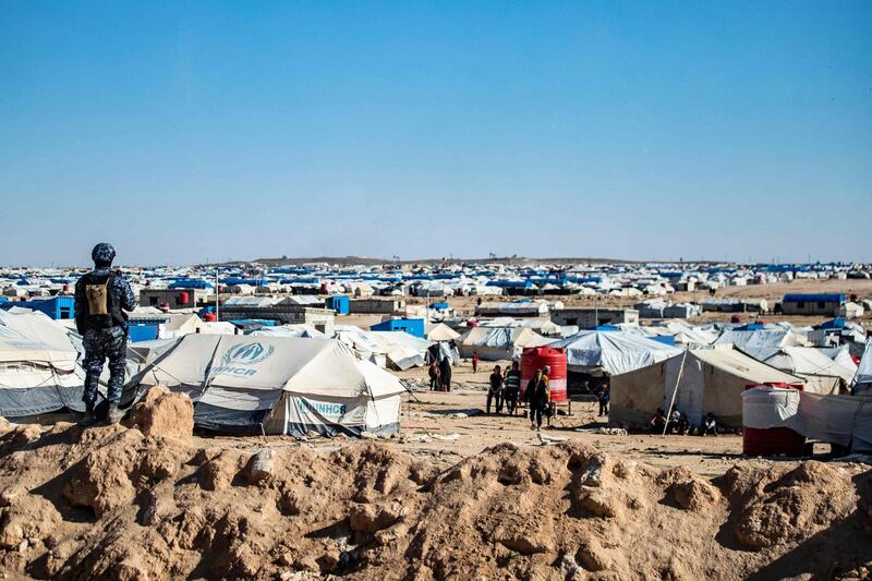 Special forces of the Syrian Democratic Forces keep watch on March 30, 2021 in the vicinity of al-Hol camp, the larger of two Kurdish-run displacement camps for relatives of Islamic State jihadists in Syria's northeast. Kurdish forces said they had arrested 53 suspected Islamic State group members in a northeast Syria camp for relatives of jihadists, in an anti-IS security operation. / AFP / Delil SOULEIMAN
