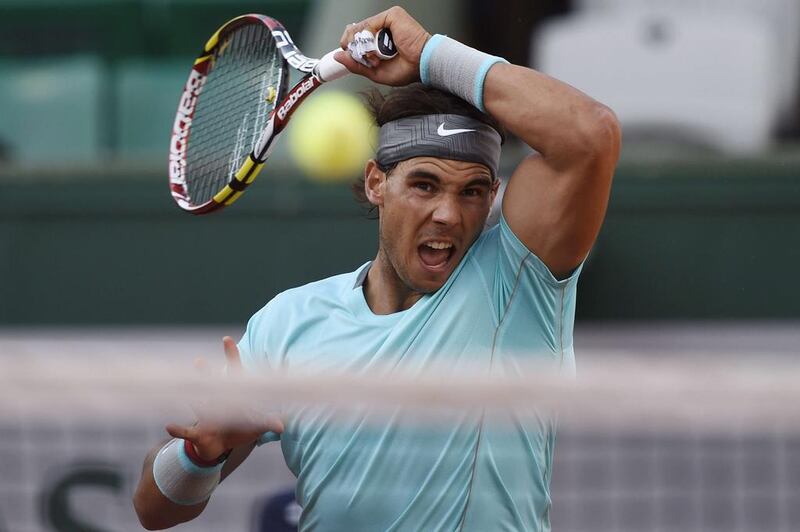 Rafael Nadal hits a return to David Ferrer during the French Open in June at Roland Garros. Dominique Faget / AFP / June 4, 2014 