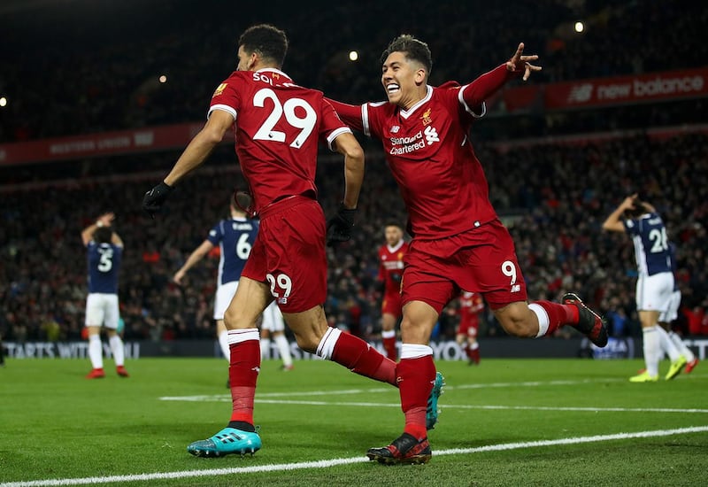 LIVERPOOL, ENGLAND - DECEMBER 13:  Dominic Solanke of Liverpool celebrates after scoring his sides first goal with Roberto Firmino of Liverpool but it is later disallowed during the Premier League match between Liverpool and West Bromwich Albion at Anfield on December 13, 2017 in Liverpool, England.  (Photo by Clive Brunskill/Getty Images)