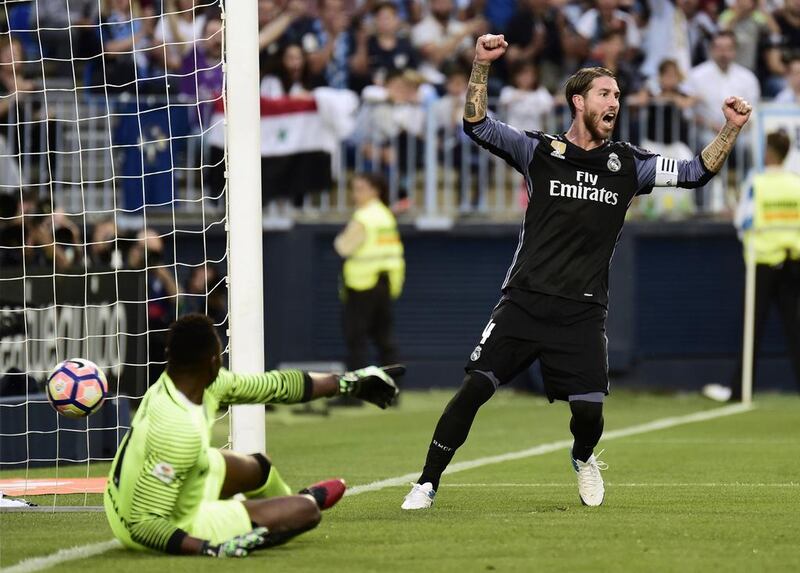 Real Madrid defender Sergio Ramos celebrates a goal by Real Madrid’s French forward Karim Benzema. Jose Jordan / AFP
