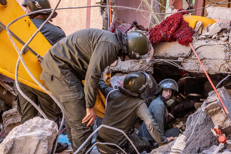 Rescue workers search for survivors in a collapsed house in Moulay Brahim, Al Haouz province, after an earthquake on Friday. AFP