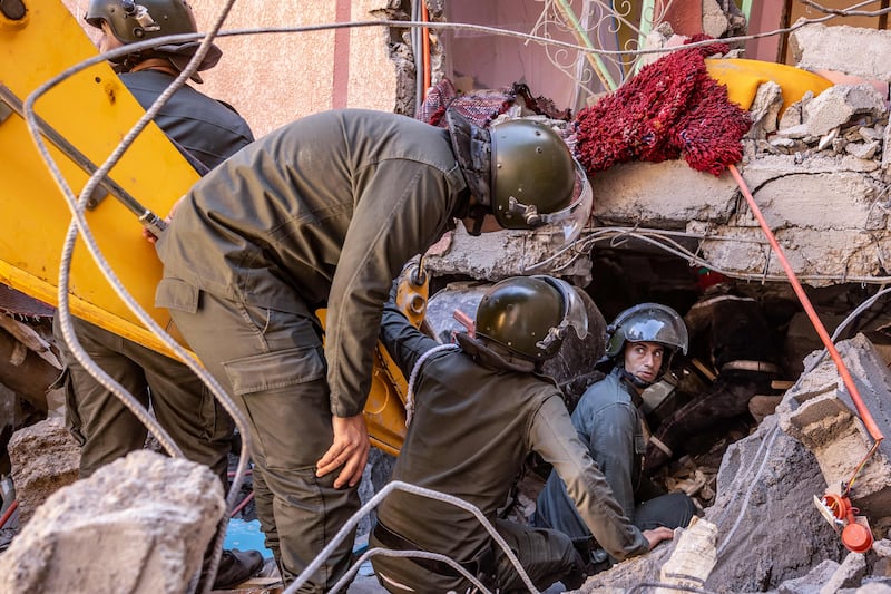 Rescue workers search for survivors in a collapsed house in Moulay Brahim, Al Haouz province, after an earthquake on Friday. AFP