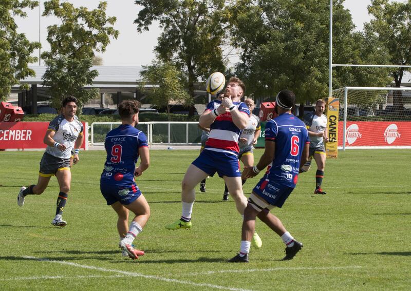 Dubai Hurricanes (grey/white shirts) take on Jebel Ali Dragons at The Sevens Stadium in Dubai. Ruel Pableo for The National