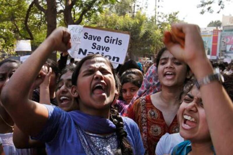 Indian students shout slogans during a protest rally in Hyderabad, India. The main suspect in the gang rape of a woman on a New Delhi bus has committed suicide in jail. AP Photo / Mahesh Kumar