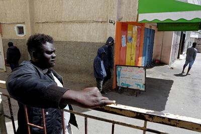 African migrants stand at Hay el Farah area, during a lockdown to contain the spread of the coronavirus disease (COVID-19), on the outskirts of Rabat, Morocco, April 3, 2020. REUTERS/Youssef Boudlal