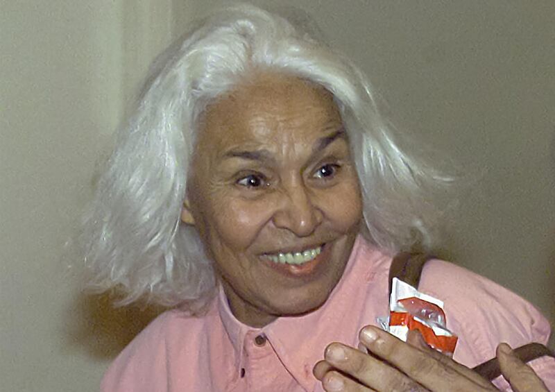 Nawal El Saadawi smiles as she arrives at the prizes ceremony of Egypt's Sixth National Film Festival in Cairo on June 29, 2000. AFP
