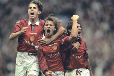 Gary Neville (left), David Beckham (centre) are two members of the 100 club at Manchester United. Allsport