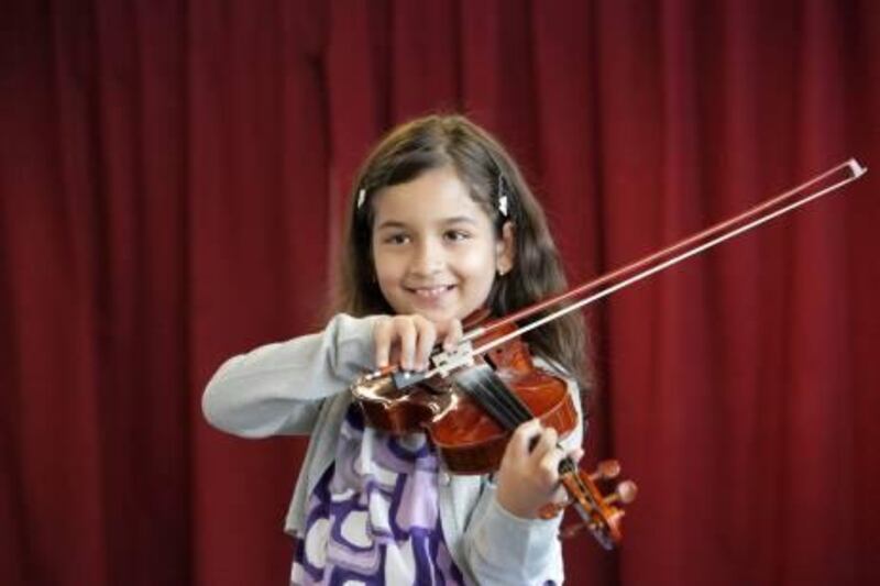 United Arab Emirates - Dubai - Oct 02 - 2010 : Young Emirati girl Khawla pose for a portrait during a class of the youth symphony orchestra directed by instructor Riad Al Kudsi at dubai media city. ( Jaime Puebla / The National )