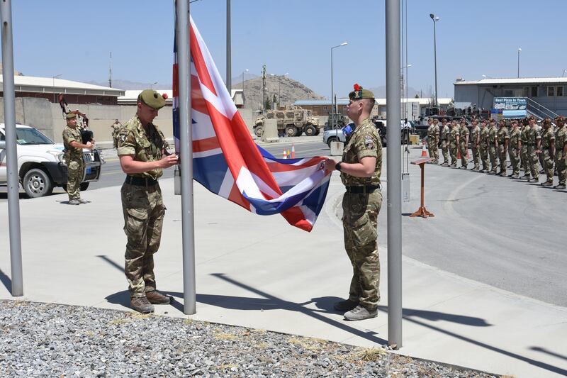 Military leaders attend a flag-lowering ceremony in Afghanistan on June 24, 2021 as the UK’s contribution in the country draws to a close. A number of troops were to remain to offer diplomatic assurance to the international community in Kabul. Getty Images