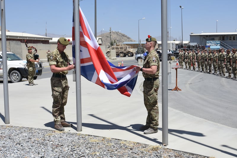 Military leaders attend a flag-lowering ceremony in Afghanistan on June 24, 2021 as the UK’s contribution in the country draws to a close. A number of troops were to remain to offer diplomatic assurance to the international community in Kabul. Getty Images