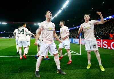 epa07418330 Manchester's Diogo Dalot (L) and Scott McTominay (R) celebrate after the UEFA Champions League round of 16 second leg soccer match between PSG and Manchester United at the Parc des Princes Stadium in Paris, France, 06 March 2019.  EPA/IAN LANGSDON