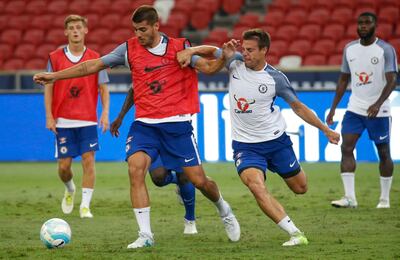 epa06106669 Chelsea's Alvaro Morata (L) and Cesar Azpilicueta (R) in action during a training session at the National Stadium in Singapore, 24 July 2017. Chelsea FC face FC Bayern Munich in a 2017 International Champions Cup (ICC) soccer match on 25 July.  EPA/WALLACE WOON