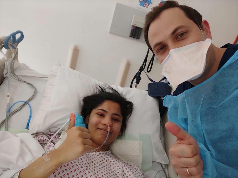 Hoor Elnayed with Dr Charbel Moussallem, right, after her spinal fusion corrective surgery