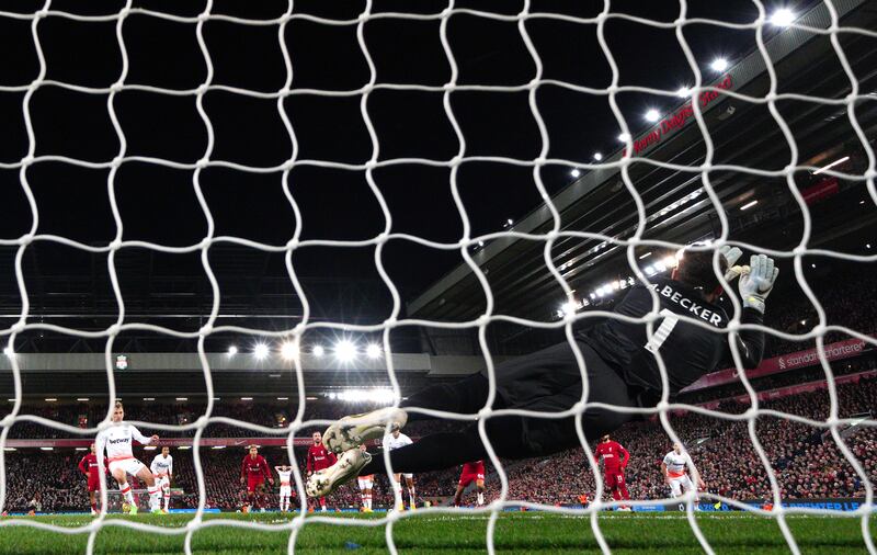 Liverpool goalkeeper Alisson Becker saves a penalty from West Ham's Jarrod Bowen. PA