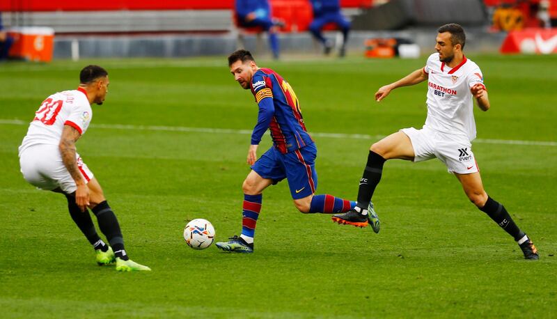 Barcelona's Lionel Messi runs at the Sevilla defence. Reuters