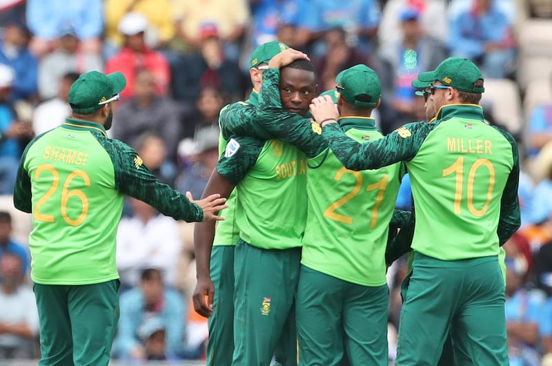 South Africa's Kagiso Rabada, center, celebrates with teammates the dismissal of India's Shikhar Dhawan during the Cricket World Cup match between South Africa and India at the Hampshire Bowl in Southampton, England, Wednesday, June 5, 2019. (AP Photo/Aijaz Rahi)