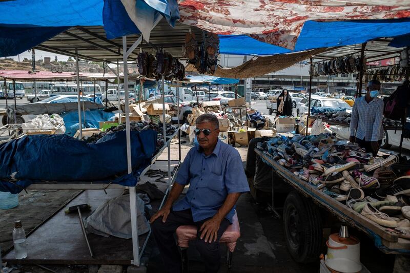 Khalaf Sabir waits for customers at his second hand shoe store in a market in Kirkuk, Iraq. On September 4, Iraq recorded 5,036 coronavirus cases, its biggest daily increase since the start of the outbreak.  The surge has prompted warnings from Iraq's health minister and WHO that the country could be on the verge of a health crisis as pressure mounts on the already strained healthcare system. Since the first case was recorded in February, Iraq has recorded 252,075 total cases and 7,359 deaths. Getty Images