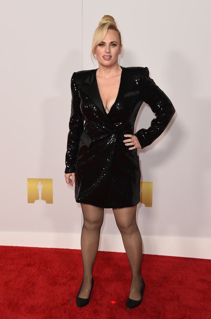 Rebel Wilson, wearing a black sequinned blazer dress, arrives at the Academy Museum of Motion Pictures Premiere Party in Los Angeles on September 29, 2021. AP Photo