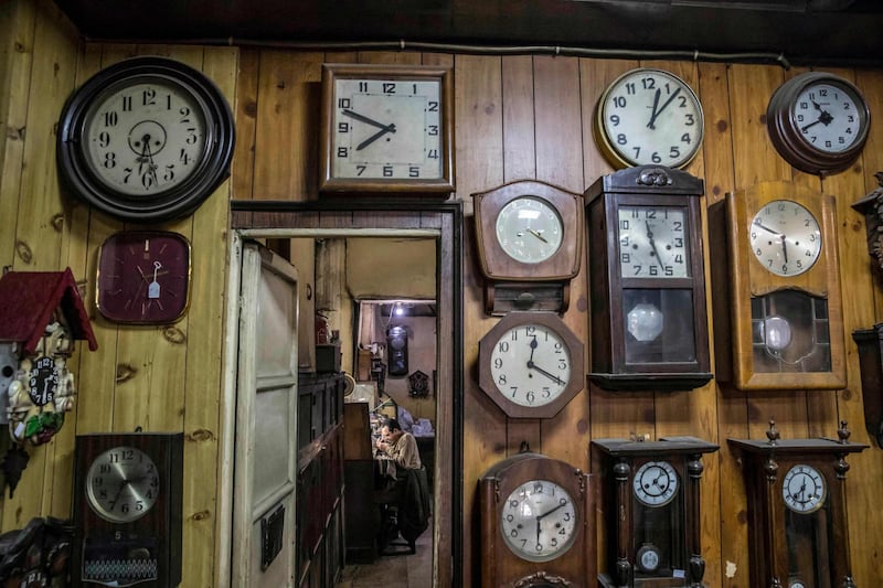 Clocks decorate a wall of the Francis Papazian watchmaker's shop in Cairo. The shop has been part of the city for more than a century. AFP