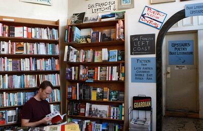 (FILES) In this file photo taken on October 03, 2007, a man reads a book at the City Lights Bookstore in the North Beach neighborhood of San Francisco, California.  Lawrence Ferlinghetti, the last great poet of the Beat Generation who helped to establish the counter-culture movement of 1950s America through his City Lights bookshop and publishers, has died, the store announced on February 23, 2021. He was 101. "We love you, Lawrence," City Lights said on Twitter, adding that Ferlinghetti died on February 22. / AFP / GETTY IMAGES NORTH AMERICA / Justin SULLIVAN
